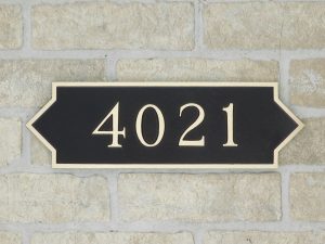 bronze house plaque with numbers