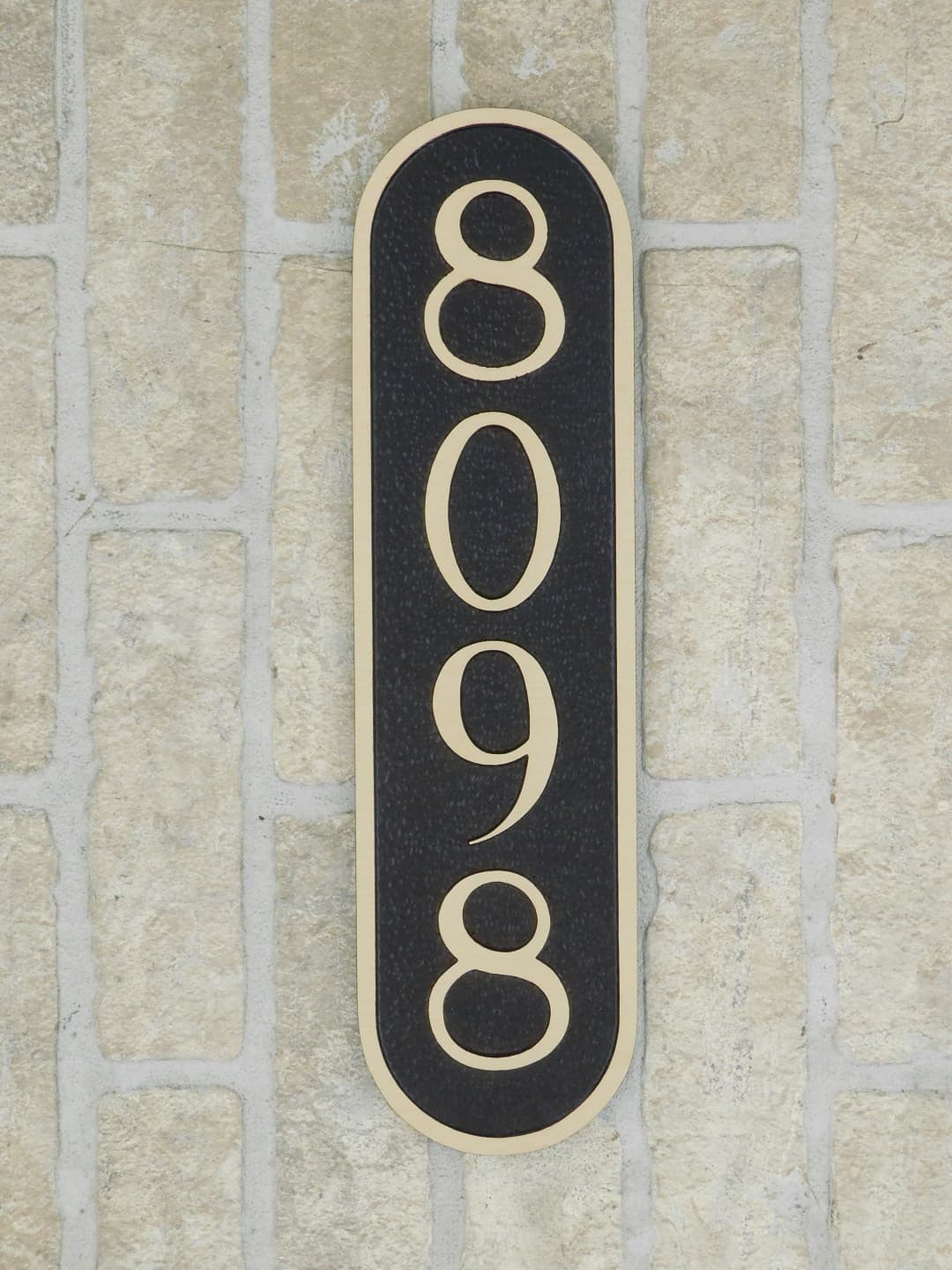 large bronze house number plaque